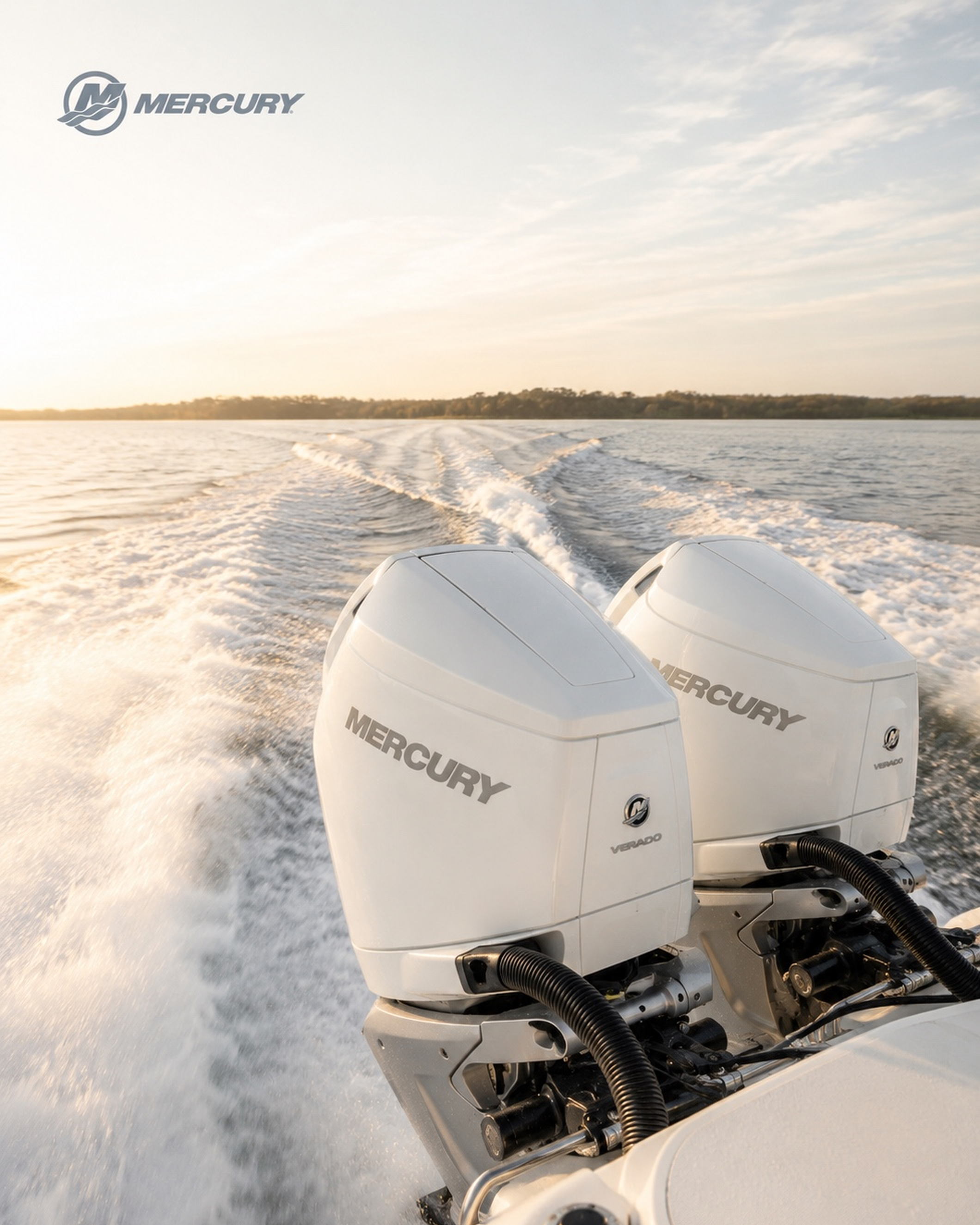 Mercury outboard engines in the foreground, with the boat's wake stretching across open water.
